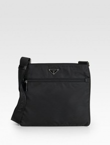 Tessuto nylon messenger with saffiano leather trim and adjustable shoulder strap.Top zip closure One outside zip pocket One inside zip pocket Triangle metal and enamel Prada logo Logo lining 12W X 10H X 2¾D Made in Italy Tessuto nylon messenger with saffiano leather trim and adjustable shoulder strap.Top zip closure One outside zip pocket One inside zip pocket Triangle metal and enamel Prada logo Logo lining 12W X 10H X 2¾D Made in Italy