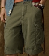 A gritty, military-inspired cargo short is lent laid-back styling with a herringbone weave and striped pocket construction for a look that is relaxed yet rugged.