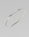 From the Bangle Collection. A single bangle of sterling silver, smooth on the outside and cabled on the inside, to wear alone or with others. Sterling silver Width, about ¼ Diameter, about 2½ Imported 