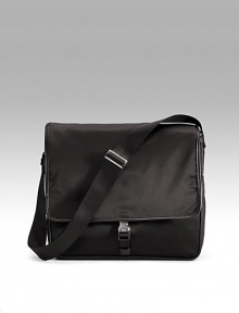 Sturdy nylon with single clip closure and adjustable shoulder strap. Front zip pocket under flap Back zip pocket Inside zip pocket Jacquard lining 14W X 12H X 4D Made in Italy Sturdy nylon with single clip closure and adjustable shoulder strap. Front zip pocket under flap Back zip pocket Inside zip pocket Jacquard lining 14W X 12H X 4D Made in Italy