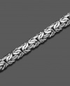 A 14k white gold bracelet with smooth, sensuous style. Approximate length: 8 inches.