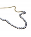 Pretty and precise. Beautiful blue-hued square-cut crystals serve as a stylish setting for the clear crystal centerpiece on this stunning necklace from Fossil. Crafted in brass tone mixed metal. Approximate length: 22 inches.