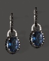 Diamonds and black diamonds circle faceted London blue topaz, set in 14K white gold.