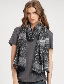 A heathered style, carefully woven with yarns of multiple weights for a textured design with a fun fringe. 40% wool/30% polyacrylic/30% polyamideAbout 77 X 18Dry cleanMade in Italy of imported fabrics A heathered style, carefully woven with yarns of multiple weights for a textured design with a fun fringe. 40% wool/30% polyacrylic/30% polyamideAbout 77 X 18Dry cleanMade in Italy of imported fabrics