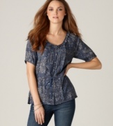 Add romance to your favorite jeans with this petite top from DKNY Jeans, featuring mini pleats, a vintage-inspired floral print and a chic tie waist.