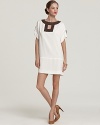 Contrast edging lends a graphic punch to this Milly dress, cut in a flattering, airy silhouette.