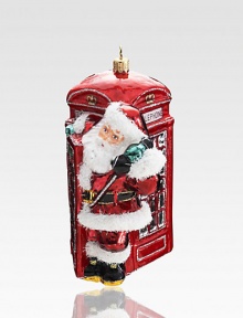 Father Christmas takes a trip across the pond in this eye-catching tree-trimmer, rendered in exquisite mouthblown and hand-painted glass.Hand-painted glass6 highImported