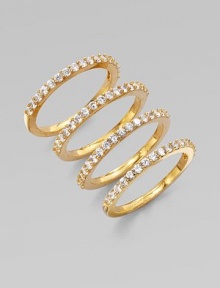 A set of four goldtone rings accented with sparkling cubic zirconia. Goldtone brassCubic zirconiaWidth, about ¼ when worn togetherImported 