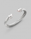 From the Silver Ice Collection. A signature Yurman cable of sterling silver, richly enhanced by bands of pavé diamonds encircling lustrous white freshwater pearl end caps. Diamonds, 0.48 tcw White freshwater pearls Sterling silver Cable, 7mm Diameter, about 2¼ Made in USA