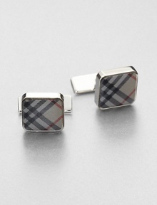 Set a new sartorial standard with polished links that feature the iconic check design. About ½ square 50% brass/50% enamel Imported 