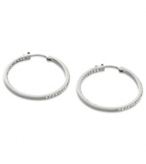 Go full-blitz with these glitzy hoop earrings from Fossil. The classic design is amped up with clear pave crystal accents. Crafted in polished stainless steel. Approximate diameter: 1-3/8 inches.