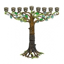 A creatively luxe essential for celebrating the holidays, this tree-inspired menorah glitters with dozens of hand-set Swarovski® crystals and glass gems set in hand-enameled cast pewter with an antique brash finish. A creatively luxe essential for celebrating the holidays, this tree-inspired menorah glitters with dozens of hand-set Swarovski® crystals and glass gems set in hand-enameled cast pewter with an antique brash finish.