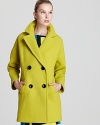 Brighten up the blustery winter in a neon Milly double-breasted jacket, bold with large black buttons for a cool contrast for shades. The perfect way to inject light into a dark-shaded wardrobe, this warm layer works seven days a week.