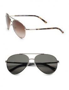 A classic aviator style with tubular temple and double bridge featuring the celebrated Prada signature logo. Available in gold with brown lens or gunmetal with grey lens. Metal UV 400 lens 100% UV protection Made in Italy A classic aviator style with tubular temple and double bridge featuring the celebrated Prada signature logo. Available in gold with brown lens or gunmetal with grey lens. Metal UV 400 lens 100% UV protection Made in Italy