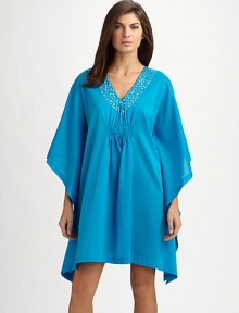 Delicate metal embellishments adds a touch of sparkle to this easy cotton silhouette, perfect for lounging poolside. V-neckMetal embellished necklineThree-quarter length wide dolman sleevesCenter ruchingAbout 36 from shoulder to hemCottonMachine washImported Delicate metal embellishments adds a touch of sparkle to this easy cotton silhouette, perfect for lounging poolside. V-neckMetal embellished necklineThree-quarter length wide dolman sleevesCenter ruchingAbout 36 from shoulder to hemCottonMachine washImported
