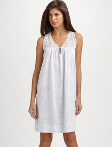 A back pleat and lace yoke embellishment add definition to a classic chemise. A back pleat and lace yoke embellishment add definition to a classic chemise.