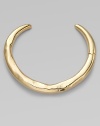 This golden collar has a sensuous molten look that makes a dramatic yet simple statement.18k goldplated Diameter, about 5¼ Hinged clasp on one side Imported