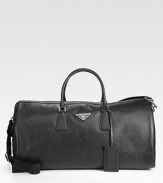 Textured saffiano leather duffel with tessuto nylon lining.Double top handlesAdjustable shoulder strapsZip closureFully lined21W x 10¼H x 9DMade in Italy