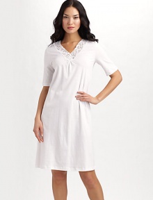 From the Moments collection, this ultra-fine, mercerized cotton knit is accented with soft stretch lace.Lace V neckline with shirring Short sleeves About 39¼ from shoulder to hem Mercerized cotton Machine wash Imported