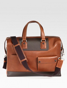 Enjoy a stylish getaway compliments of this refined classic duffel style, expertly crafted in Italian calfskin leather with exterior flap pockets and contrast patch detail.Zip closureDouble top handlesAdjustable shoulder strapExterior buttoned pocketsInterior zip pocketFully linedLeather17W x 13H x 6DMade in Italy Enjoy a stylish getaway compliments of this refined classic duffel style, expertly crafted in Italian calfskin leather with exterior flap pockets and contrast patch detail.Zip closureDouble top handlesAdjustable shoulder strapExterior buttoned pocketsInterior zip pocketFully linedLeather17W x 13H x 6DMade in Italy