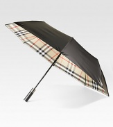 This walking umbrella offers a shiny-sleek look and ample coverage from the elements.Automatic openOpen diameter, about 47Folded length, about 37PolyesterImported