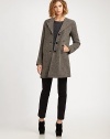 Classic wool style features a lengthy, textured tweed silhouette. Extended point collar Button front Slash pockets Long sleeves Fully lined About 33 from natural waist Wool Dry clean Imported Model shown is 5'9½ (176cm) wearing US size 4.
