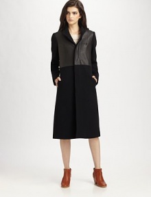 Ageless, wool-rich coat with gleaming leather trim and convenient slash pockets. Button frontLong sleevesSlash pocketsAbout 42 from shoulder to hemBody: 75% wool/25% nylon; Contrast: LeatherDry clean with leather specialistMade in USAModel shown is 5'10 (177cm) wearing US size 2. Ageless, wool-rich coat with gleaming leather trim and convenient slash pockets. Button frontLong sleevesSlash pocketsAbout 42 from shoulder to hemBody: 75% wool/25% nylon; Contrast: LeatherDry clean with leather specialistMade in USAModel shown is 5'10 (177cm) wearing US size 2.