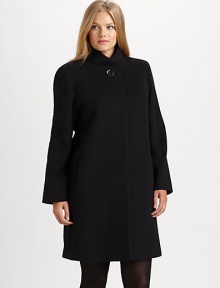 Simply elegant and made from fine Italian fabrication, a stand-collar coat with classic princess seams, convenient pockets and a universally flattering A-line silhouette.Button closure at stand collarPrincess seamsSlash pocketsFully linedAbout 36 from shoulder to hemWool/angora/nylonDry cleanImported of Italian