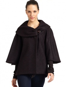 THE LOOKDramatic portrait collar with button closureThree-quarter length cape sleevesButton closures at sidesTHE FITAbout 27 from shoulder to hemTHE MATERIALFleece wool/nylonFully linedCARE & ORIGINDry cleanMade in ItalyModel shown is 5'9 (175cm) wearing US size 4. THE LOOKDramatic portrait collar with button closureThree-quarter length cape sleevesButton closures at sidesTHE FITAbout 27 from shoulder to hemTHE MATERIALFleece wool/nylonFully linedCARE & ORIGINDry cleanMade in ItalyModel shown is 5'9 (175cm) wearing US size 4.