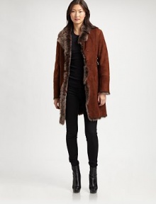 Made from dyed toscana shearling, this luxurious coat features intricate topstitching and convenient slash pockets.Notched collarHook-and-eye closureSlash pocketsTopstitching on backAbout 36 from shoulder to hemToscana shearlingDry clean by leather/fur specialistImportedFur origin: Turkey Model shown is 5'11 (180cm) wearing US size Small. Made from dyed toscana shearling, this luxurious coat features intricate topstitching and convenient slash pockets.Notched collarHook-and-eye closureSlash pocketsTopstitching on backAbout 36 from shoulder to hemToscana shearlingDry clean by leather/fur specialistImportedFur origin: Turkey Model shown is 5'11 (180cm) wearing US size Small.