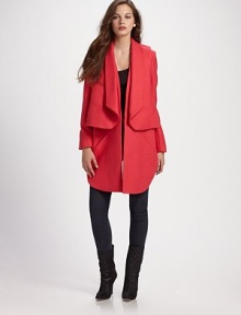 Incredibly modern and dynamic, this two-piece wool topper is comprised of a cropped vest layered over an open-front coat.Vest has shawl collar and crossover back Coat has angled pockets and asymmetrical shirttail hem Both pieces are open front Fully lined About 37 from shoulder to hem Wool Dry clean Imported