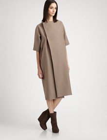 Architectural and modern, rendered in wonderfully warm melton wool.Asymmetrical concealed button closureElbow length sleevesPanel constructionCotton/silk liningAbout 41½ from shoulder to hem80% wool/20% nylonDry cleanMade in Italy of imported fabricModel shown is 5'11 (180cm) wearing US size 4. Architectural and modern, rendered in wonderfully warm melton wool.Asymmetrical concealed button closureElbow length sleevesPanel constructionCotton/silk liningAbout 41½ from shoulder to hem80% wool/20% nylonDry cleanMade in Italy of imported fabricModel shown is 5'11 (180cm) wearing US size 4.