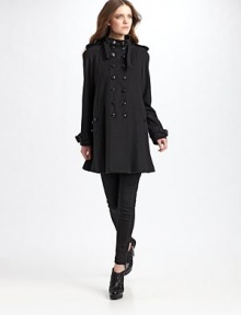 An exceptional double-breasted design tailored of warm wool/cashmere in a full, swing silhouette detailed with multiple logo buttons.Shoulder epaulettes Funnel neck with buckled tab Raglan sleeves with buckled tabs at cuffs Buttoned side pockets Back buttoned flap Back inverted pleat for fullness About 34 from shoulder to hem 80% virgin wool/20% cashmere Dry clean Imported An exceptional double-breasted design tailored of warm wool/cashmere in a full, swing silhouette detailed with multiple logo buttons.Shoulder epaulettes Funnel neck with buckled tab Raglan sleeves with buckled tabs at cuffs Buttoned side pockets Back buttoned flap Back inverted pleat for fullness About 34 from shoulder to hem 80% virgin wool/20% cashmere Dry clean Imported