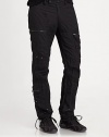 Metal zippers and grommets give a modern moto-inspired look to an essential cargo pant in lightweight cotton poplin. Belted waist with a double-snap closureAdjustable snap tabs at the side waist for a custom fitAllover silvertone grommets, zipper pulls and snapsTwo zip cargo pockets on each leg and two on the back waistRibbed-knit hem with drawcords for an adjustable fitInseam, about 32CottonMachine wash