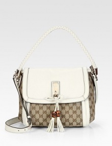 A multifunctional shoulder bag with charming details and a smart shape.Beige/ebony original GG canvasLeather trimLight fine gold hardwareDouble woven leather handles, 6 dropAdjustable and detachable shoulder strap, 21 dropWoven leather bow, GG charm A multifunctional shoulder bag with charming details and a smart shape.Beige/ebony original GG canvasLeather trimLight fine gold hardwareDouble woven leather handles, 6 dropAdjustable and detachable shoulder strap, 21 dropWoven leather bow, GG charm