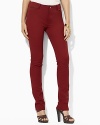 A sleek ankle-length pant is crafted in stretch cotton with a slim leg, creating a silhouette that flatters the figure.