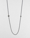 From the Starlight Collection. A long, lovely box chain of blackened sterling silver, punctuated by two spheres set with twinkling diamonds.Diamonds, .97 tcwSterling silverLength, about 36Lobster claspImported