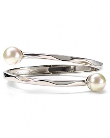 An understated offering from Majorica, this bangle features overlapping contoured sterling silver bands with man-made pearl accents.