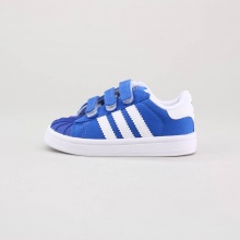 The adidas Superstar is one of our most beloved classics and available in a size for the next generation of superstars. With three velcro straps, this canvas toddlers shoe assures stability and style equally. Imported. The adidas Superstar is one of our most beloved classics and available in a size for the next generation of superstars. With three velcro straps, this canvas toddlers shoe assures stability and style equally. Imported.