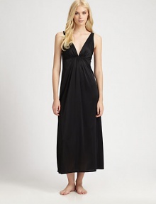 With a goddess-like appeal, this silky knit feels as divine as it looks. Deep plunging V neckline Pleated bodice Empire waist with pleating Deep V back About 54 from shoulder to hem PolyesterMachine washImported