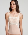 A body skimming sheer lace camisole with flattering floral details all over.