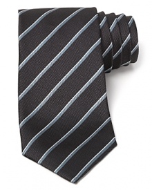 Sharpen your presentation with the simple stripe design of this luxurious silk tie, the perfect complement to your fine dress shirting. Sharpen your presentation with the simple stripe design of this luxurious silk tie, the perfect complement to your fine dress shirting.