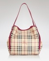 Give your look a classic finish with Burberry's leather-trimmed tote in the brand's iconic check.