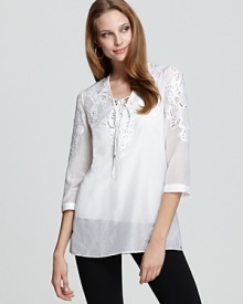 In crisp voile, Elie Tahari's Lori tunic fuses fresh and modern style. Delicate embroidery and cutout details offer a feminine finish.