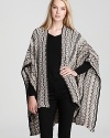 Throw Missoni's signature zig-zag print cape over any neutral outfit. The cream-colored sparkle adds a glamorous element.