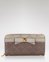 Marc Jacobs' quilted continental wallet is a girlish go-to. Fill it with your cash, cards and coins to keep the essentials stowed in lust-worthy fashion.