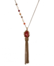 Addition by attraction. Crafted from gold tone base metal, Lucky Brand's pendant necklace features a semi-precious reconstituted calcite red stone at the center. Semi-precious carnelian, yellow jade, citrine and smokey quartz beads adorn the side. Approximate length: 23 inches + 2-inch extender. Approximate drop: 5 inches.