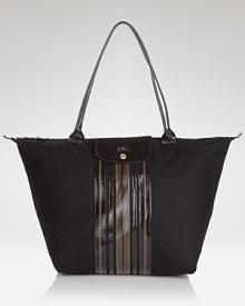 Uptown girls will love Longchamp's textured update of it's signature top handle tote. In wool with patent leather trims, it encapsulates polished practicality. Uptown girls will love Longchamp's textured update of it's signature top handle tote. In wool with patent leather trims, it encapsulates polished practicality.