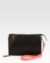 A sleek way to carry your essentials, all in super-rich leather with a chic contrast shoulder strap.Adjustable detachable shoulder strap, 20½-22½ dropTop zip closureTwo inner compartments12W X 7½H X 3/4DMade in Italy