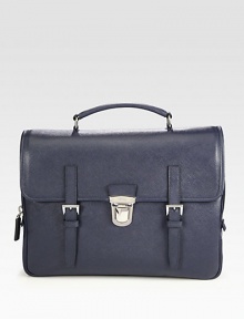 Signature briefcase style of saffiano leather with double strap closure.Flap, push lock closureTop handleInterior zip pocketsLeather14W x 11H x 4DMade in Italy Signature briefcase style of saffiano leather with double strap closure.Flap, push lock closureTop handleInterior zip pocketsLeather14W x 11H x 4DMade in Italy